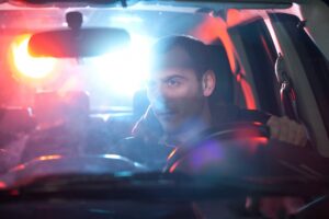A man getting pulled over under DUI suspicion. He should call Ores Law's DUI attorney.